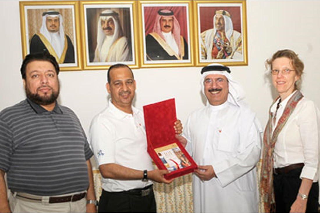 The team presents the travel guide to Mr Sayyar