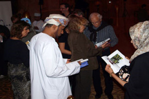 Guests enjoying their complimentary copy of 101 Things to See and Do in Oman